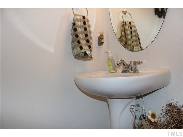 2545 Spring Oaks Way Raleigh, NC 27614 - Photo 9 of 12 Half bath on first floor with pedestal sink