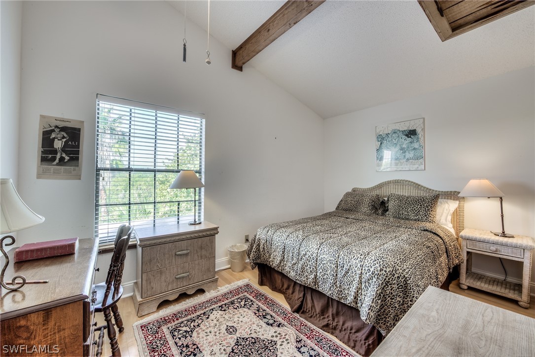 681 Rabbit Road Sanibel, FL 33957 - Photo 7 of 33 a bedroom with a large bed and a window