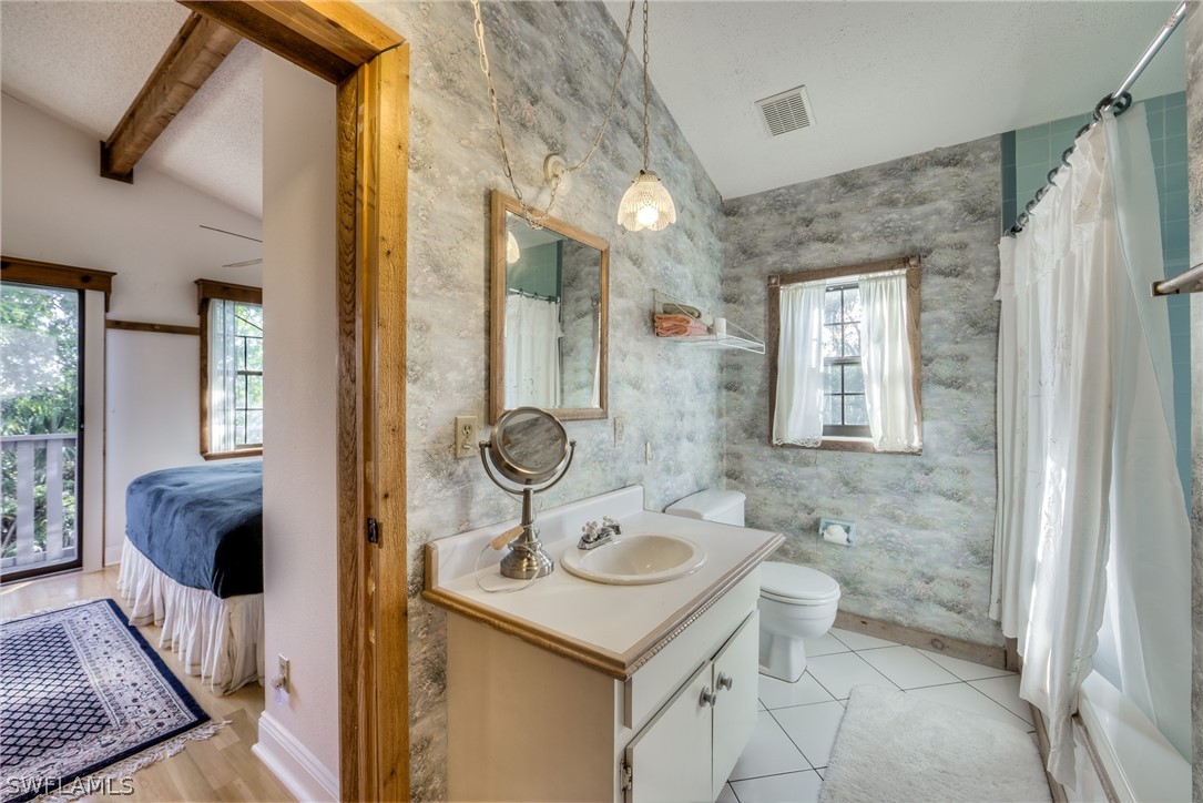 681 Rabbit Road Sanibel, FL 33957 - Photo 8 of 33 a bathroom with a sink toilet and shower