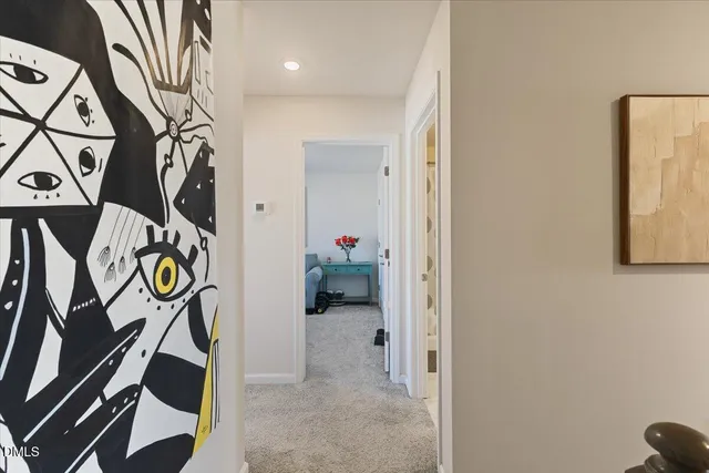 a view of a hallway with windows