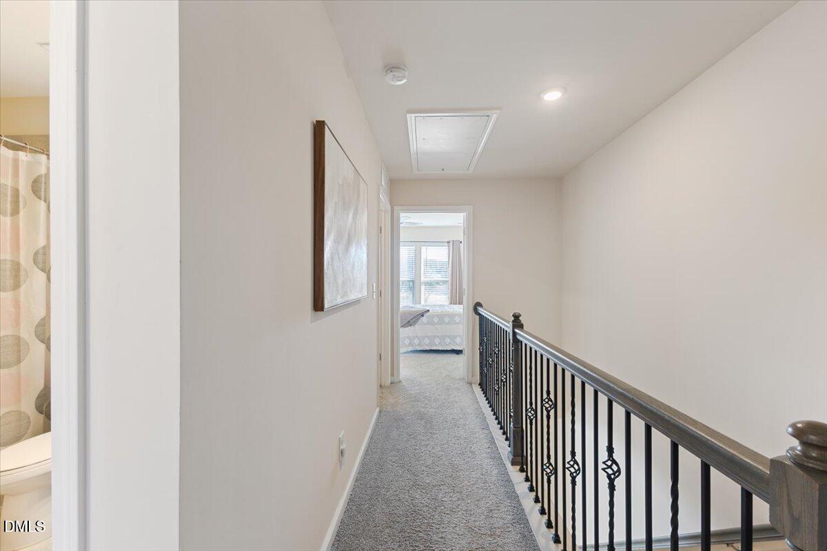 704 Colby Place Durham, NC 27713 - Photo 17 of 34 a view of a hallway with windows