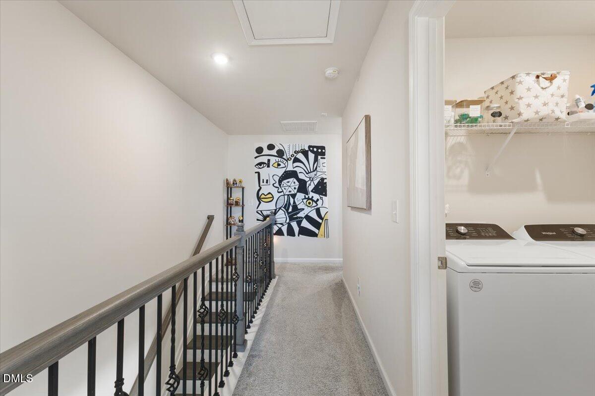 704 Colby Place Durham, NC 27713 - Photo 30 of 34 a view of a hallway to a livingroom with furniture