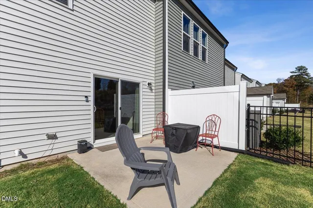 a front view of a house with a garden and a garage