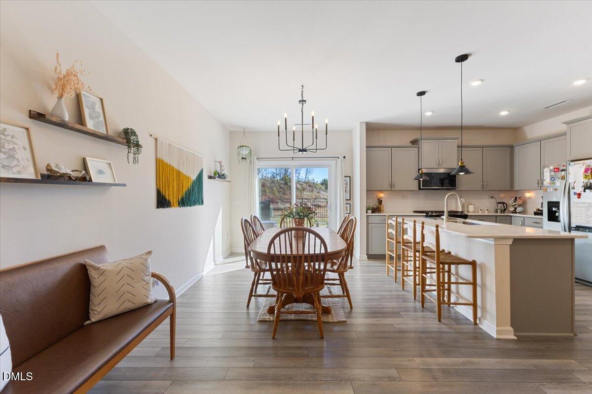 704 Colby Place Durham, NC 27713 - Photo 8 of 34 a living room with furniture a dining table and kitchen view