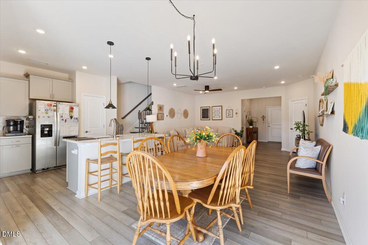 704 Colby Place Durham, NC 27713 - Photo 10 of 34 a large kitchen with a table and chairs