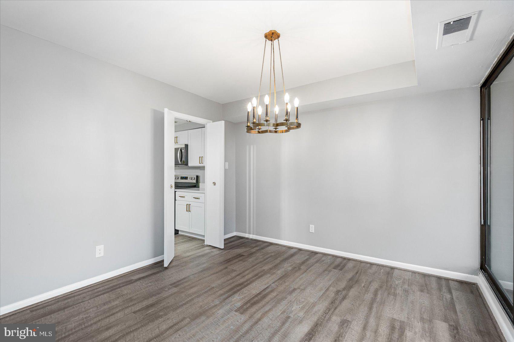 6317 Park Heights Avenue, Unit 616 Baltimore, MD 21215 - Photo 11 of 36 a view of a chandelier in a room