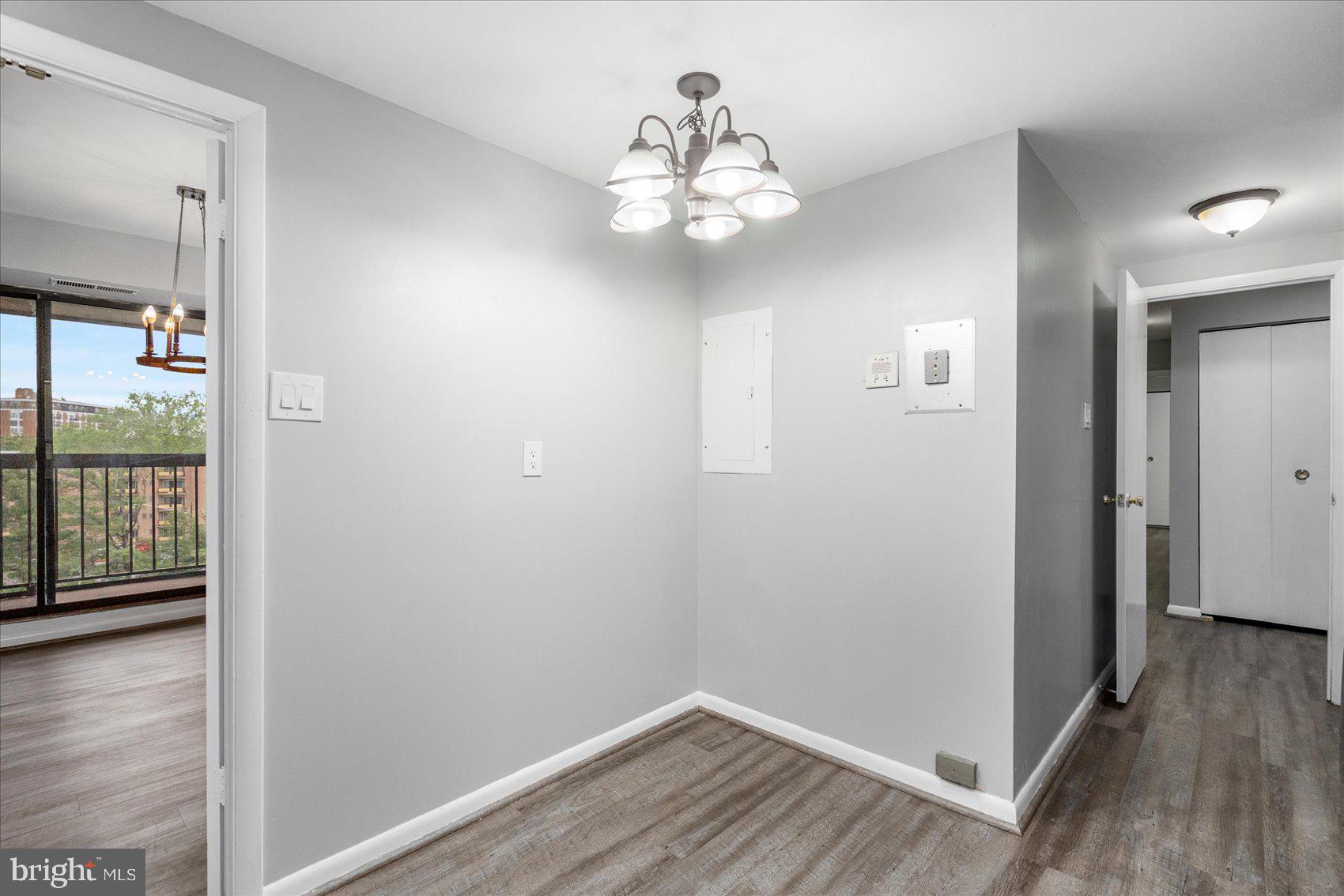 6317 Park Heights Avenue, Unit 616 Baltimore, MD 21215 - Photo 15 of 36 wooden floor in an empty room with a window