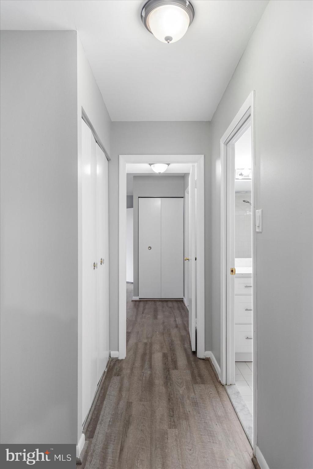 6317 Park Heights Avenue, Unit 616 Baltimore, MD 21215 - Photo 31 of 36 a view of a hallway with wooden floor