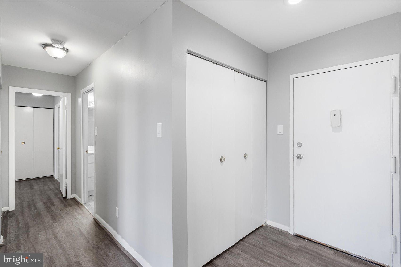 6317 Park Heights Avenue, Unit 616 Baltimore, MD 21215 - Photo 32 of 36 a view of a hallway with wooden floor