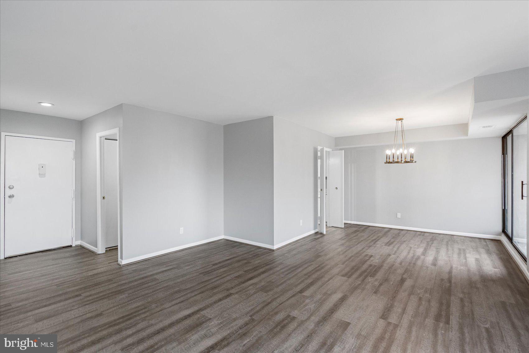 6317 Park Heights Avenue, Unit 616 Baltimore, MD 21215 - Photo 34 of 36 a view of an empty room with wooden floor