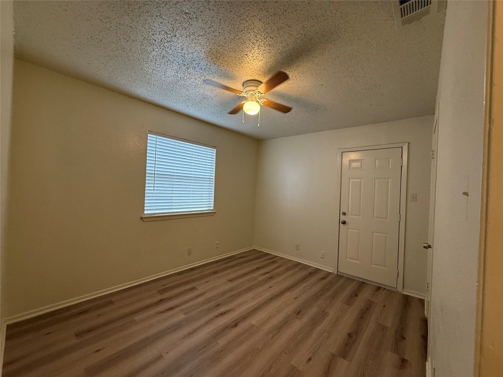 9810 Roxanna Drive, Unit C Austin, TX 78748 - Photo 6 of 10 a view of an empty room with a window