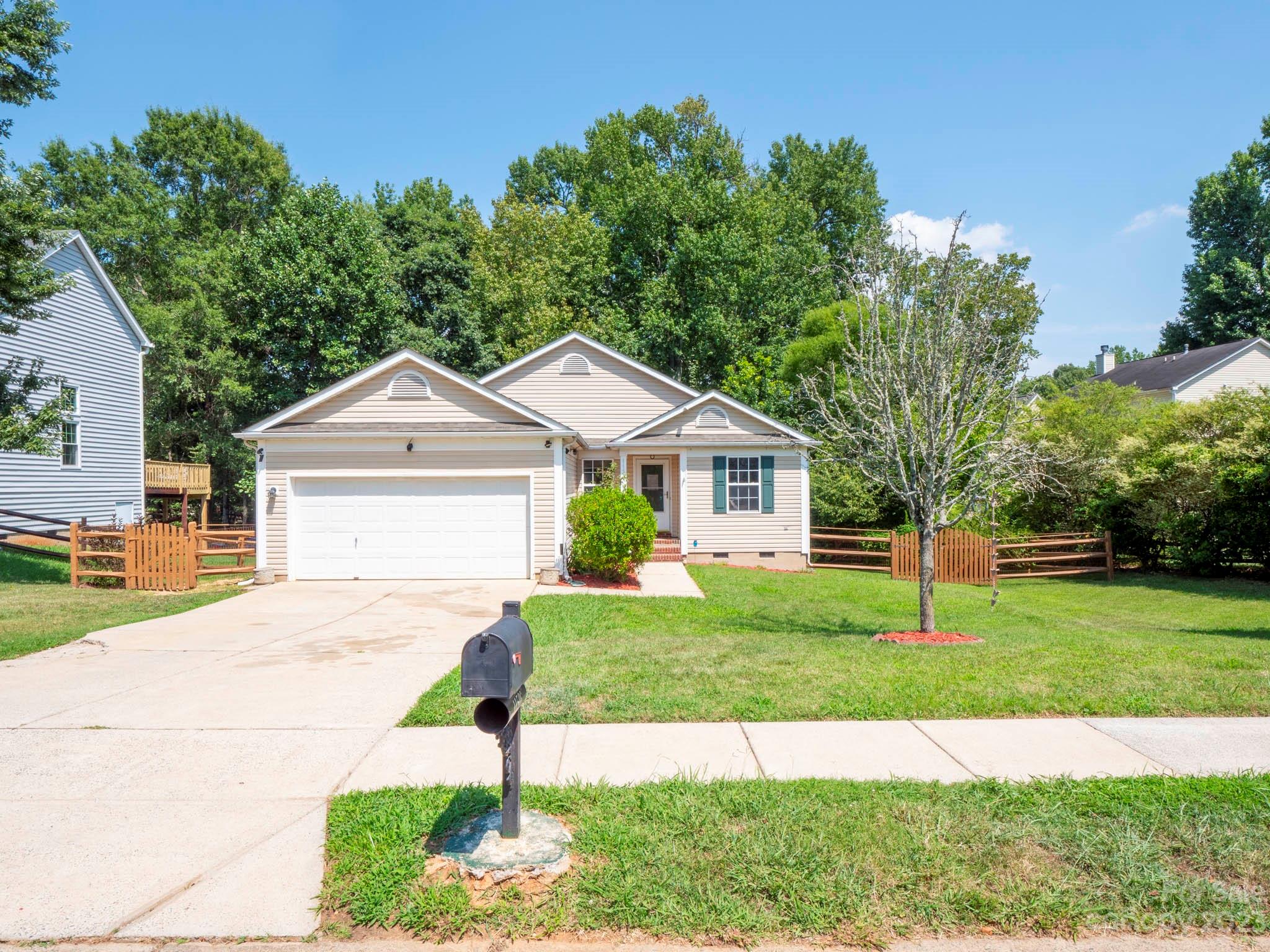 11506 Woodfire Road Charlotte, NC 28269 - Photo 1 of 48 a front view of a house with a yard