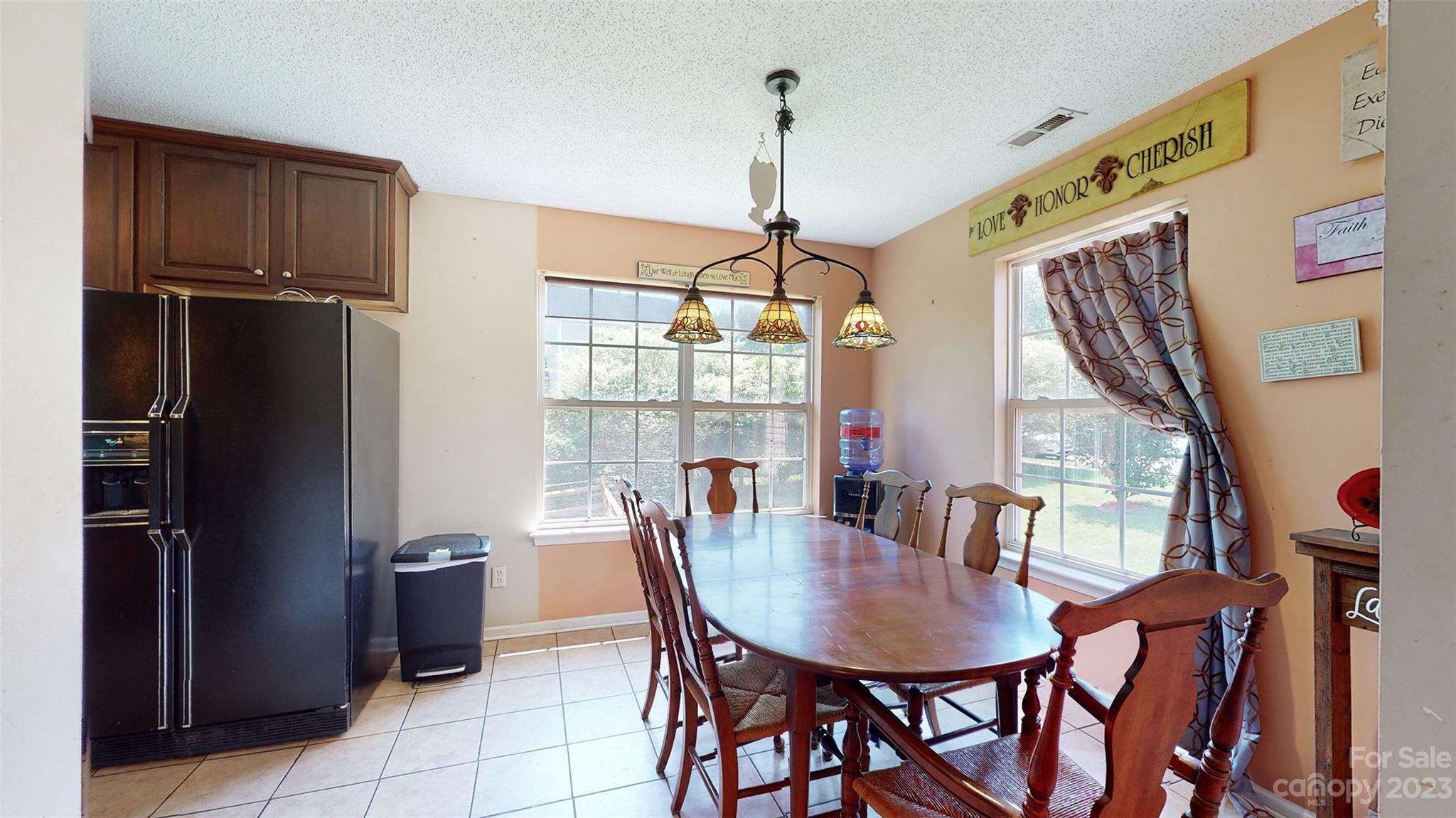 11506 Woodfire Road Charlotte, NC 28269 - Photo 11 of 48 a view of a dining room with furniture and window