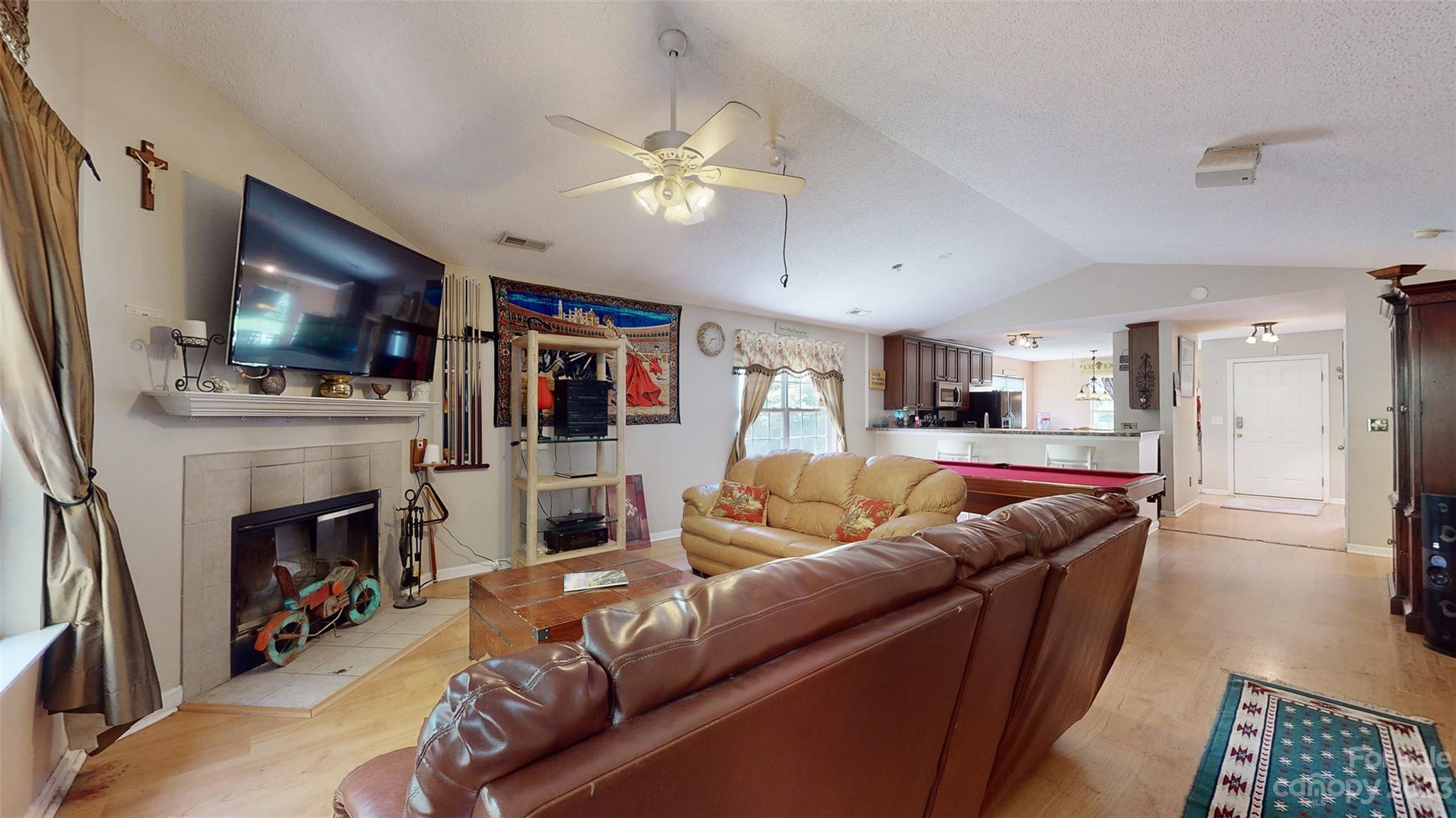 11506 Woodfire Road Charlotte, NC 28269 - Photo 27 of 48 a living room with furniture and a flat screen tv