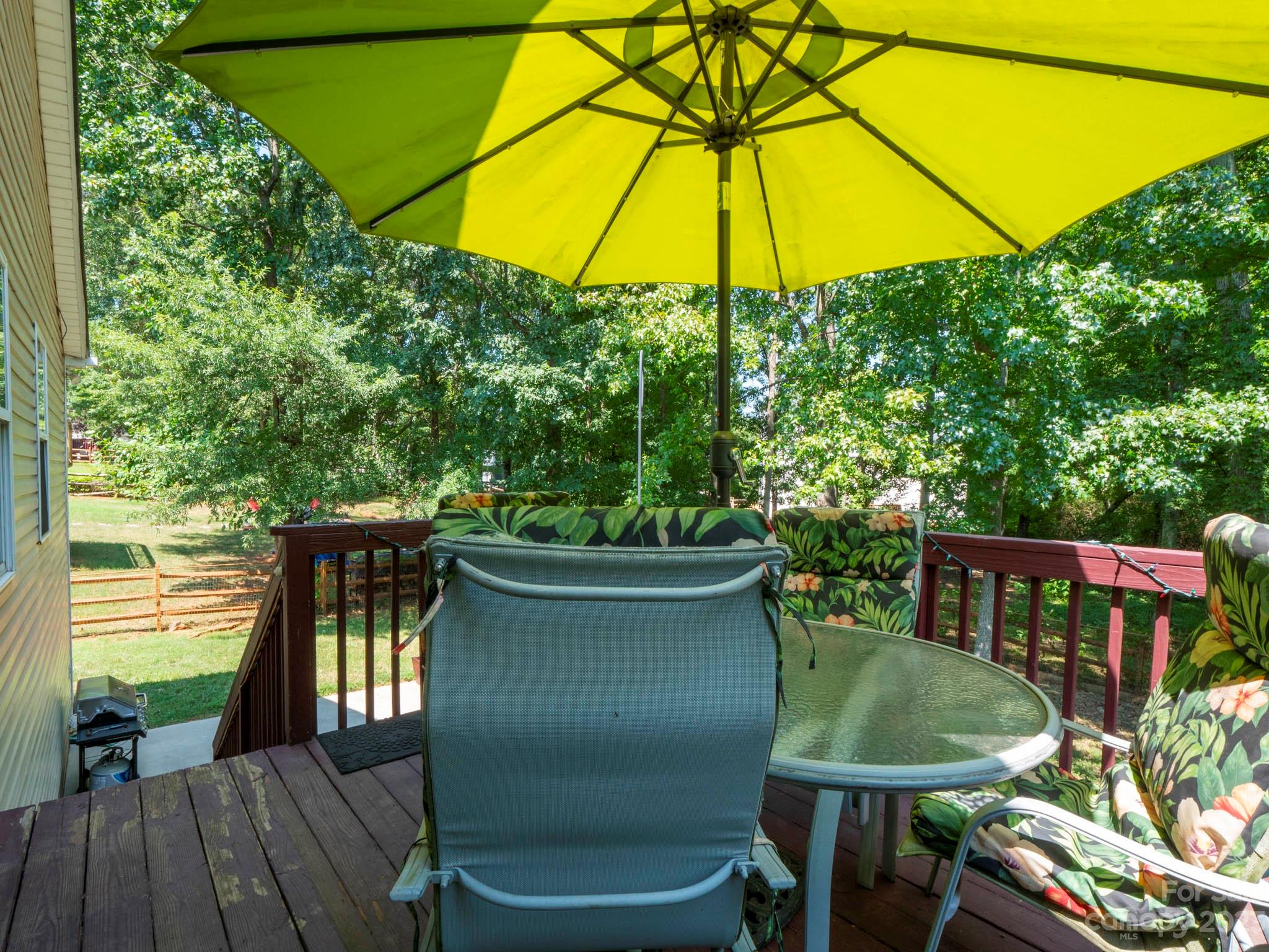 11506 Woodfire Road Charlotte, NC 28269 - Photo 46 of 48 a table and chairs in the balcony