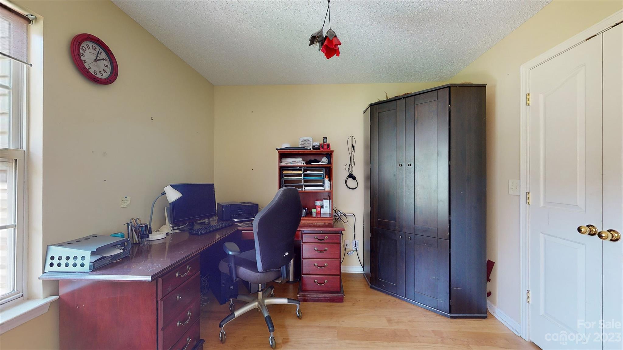 11506 Woodfire Road Charlotte, NC 28269 - Photo 6 of 48 a workspace with furniture and wooden closet