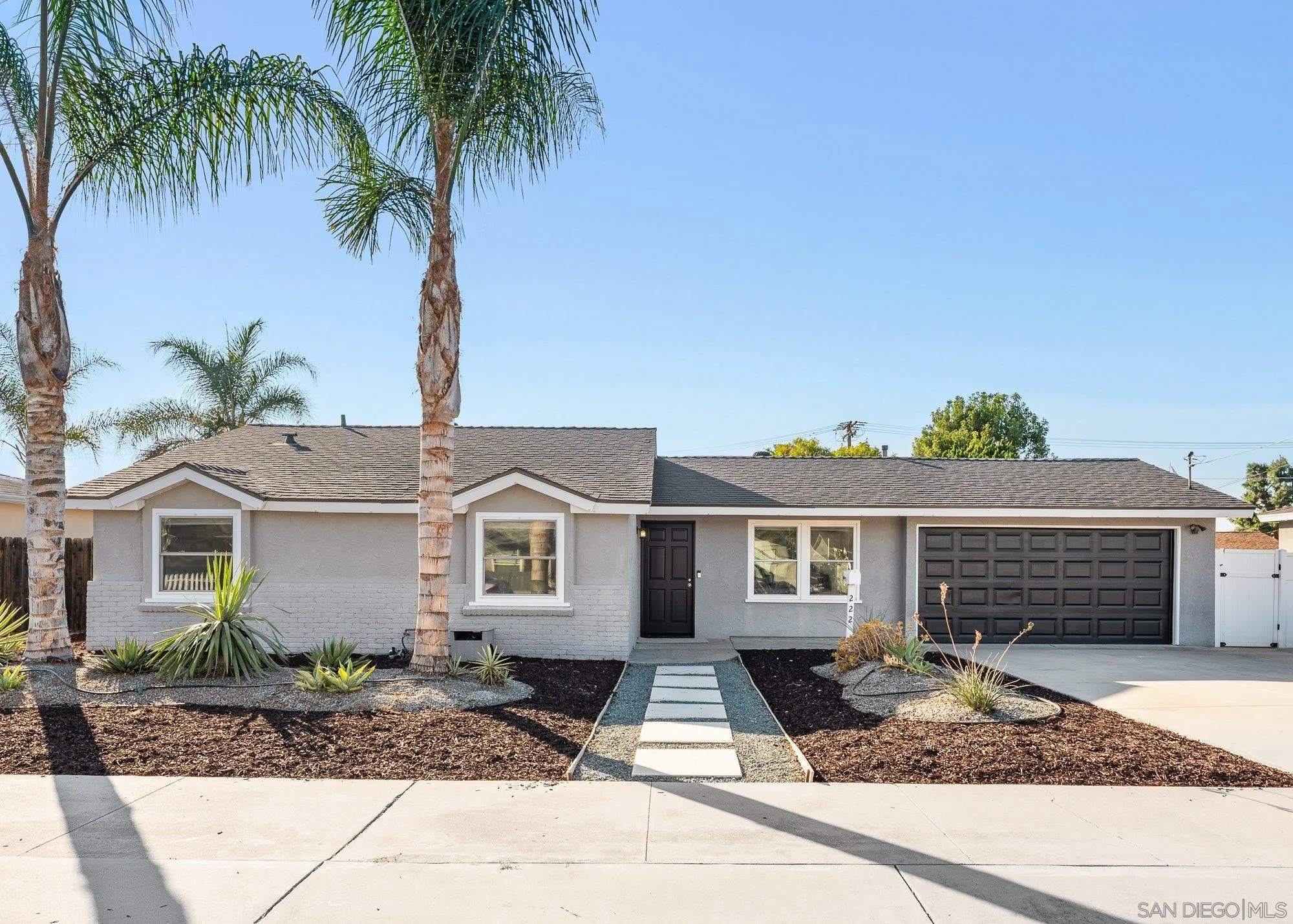 222 Gull Place El Cajon, CA 92019 - Photo 1 of 53 a front view of a house with garage and plants
