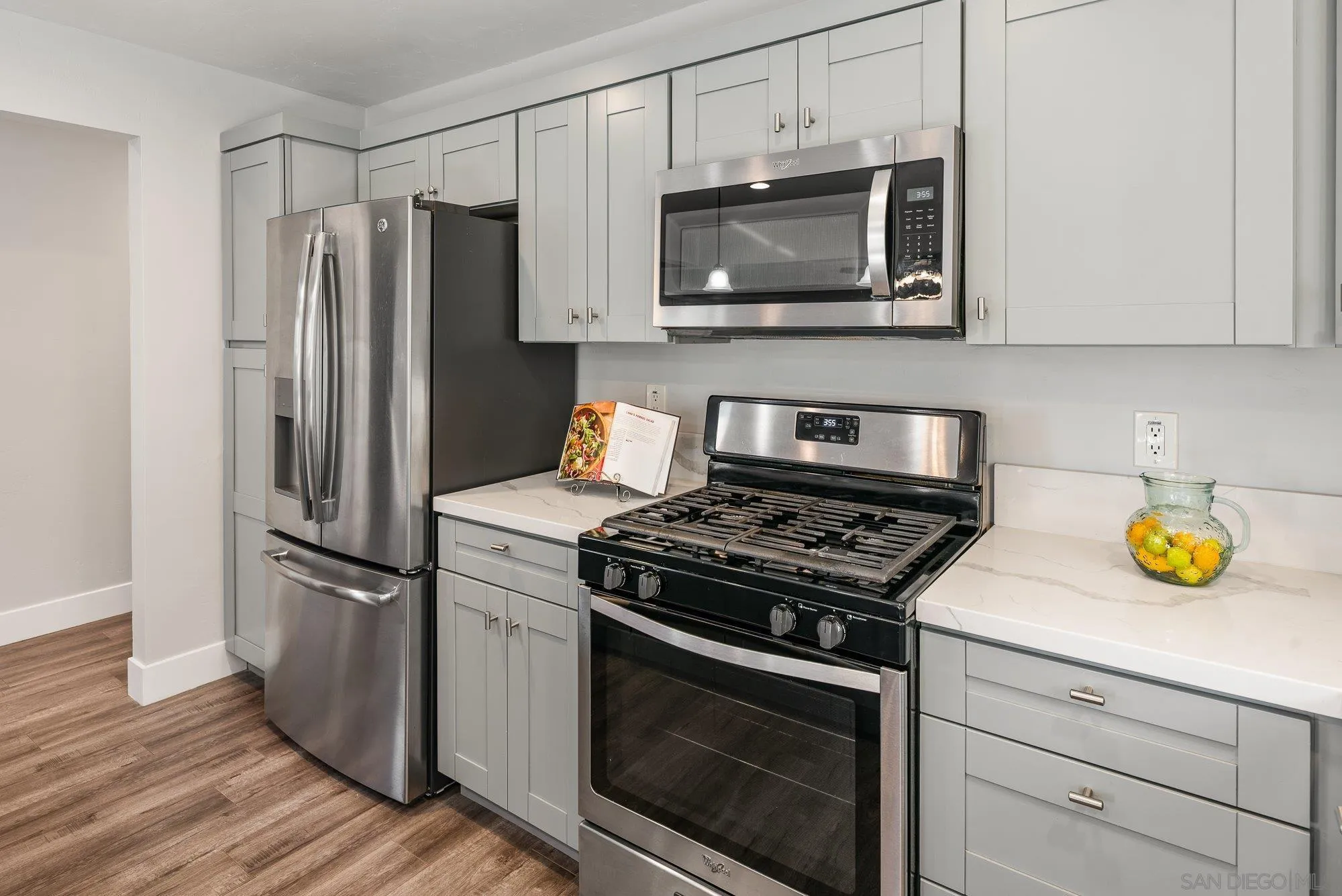 222 Gull Place El Cajon, CA 92019 - Photo 11 of 53 a kitchen with a stove and a microwave