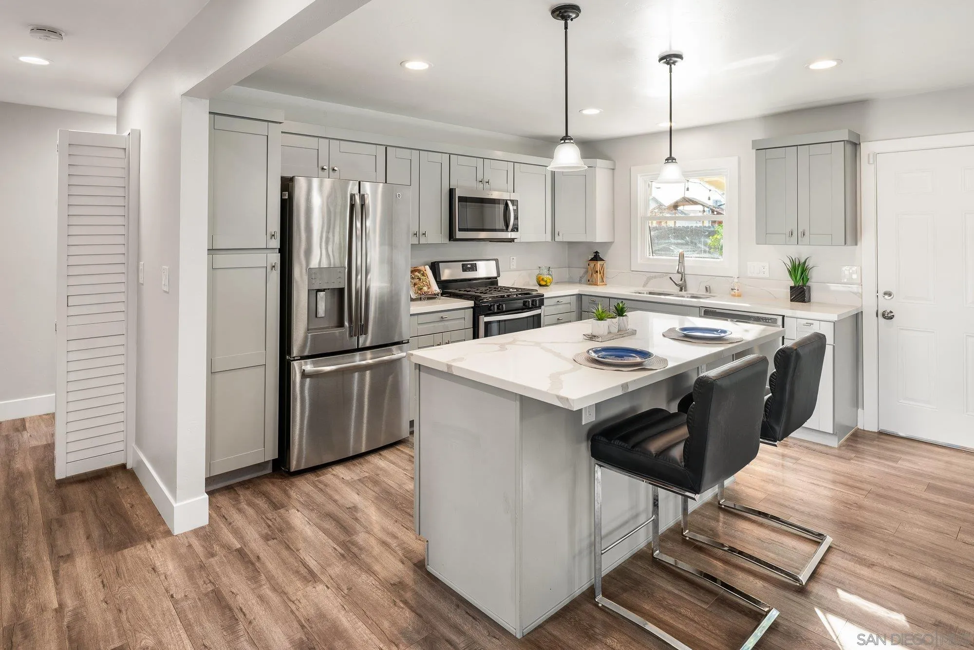 222 Gull Place El Cajon, CA 92019 - Photo 12 of 53 a kitchen with a sink stove and refrigerator