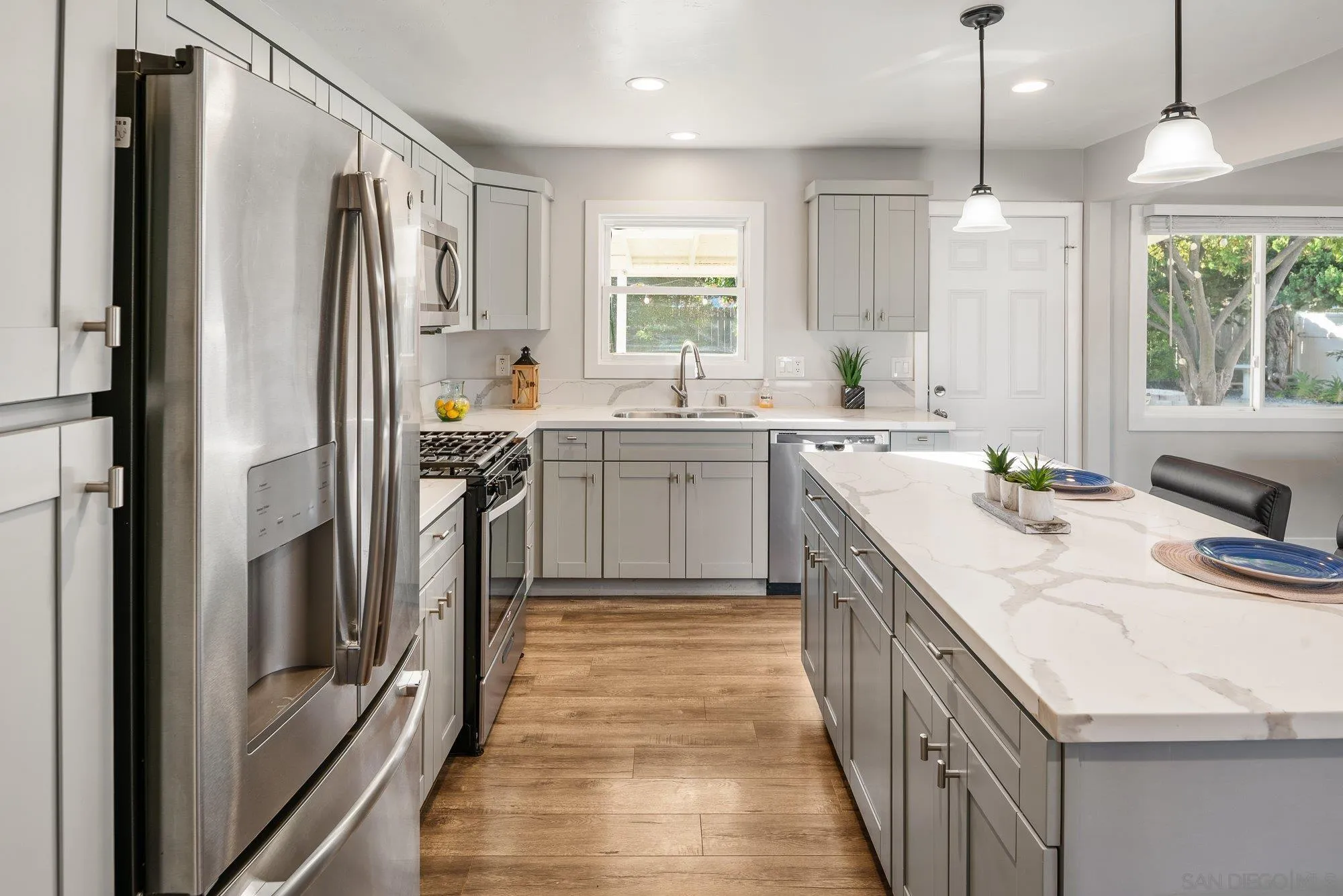 222 Gull Place El Cajon, CA 92019 - Photo 13 of 53 a kitchen with a sink stove and refrigerator