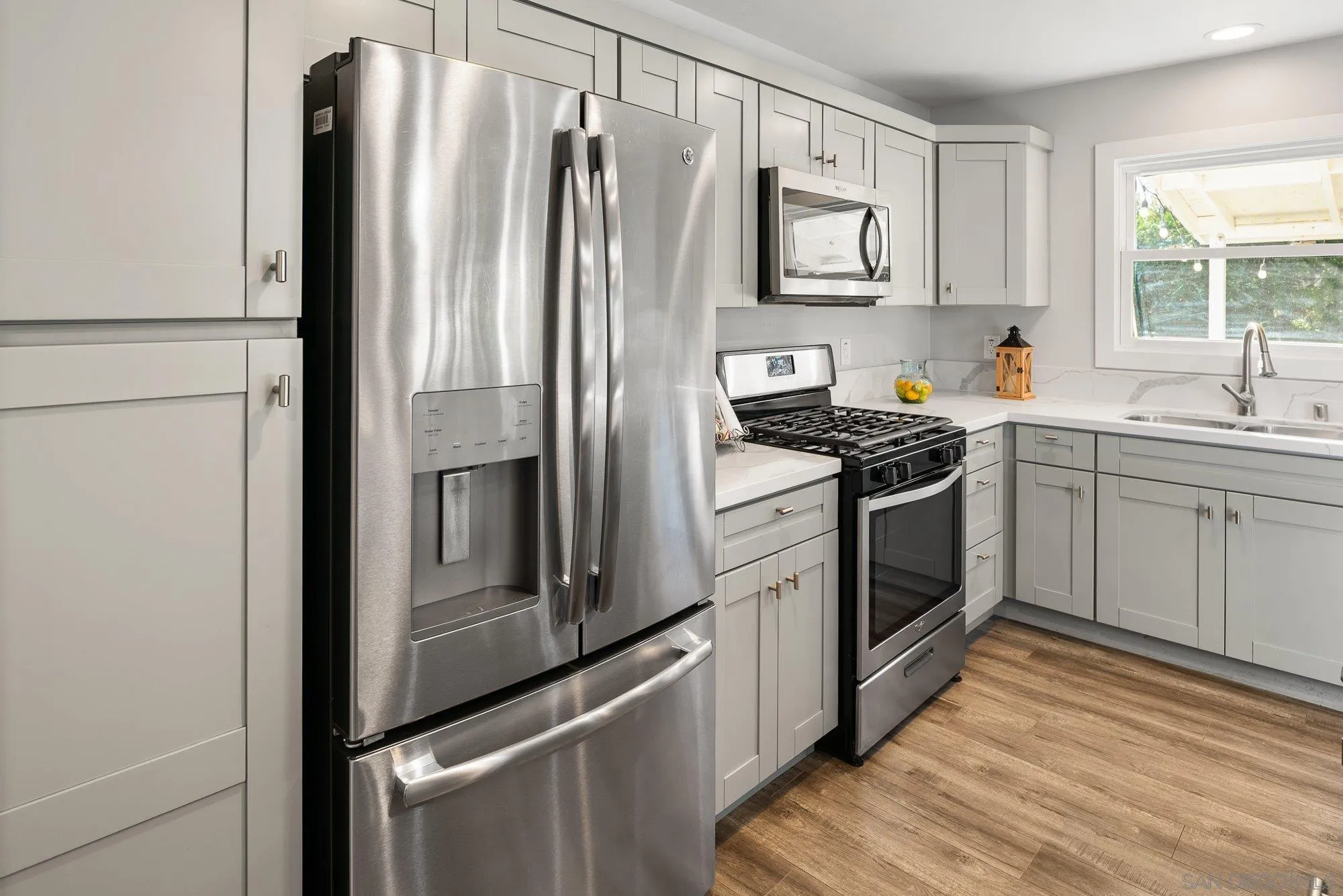 222 Gull Place El Cajon, CA 92019 - Photo 14 of 53 a kitchen with stainless steel appliances a refrigerator sink and stove