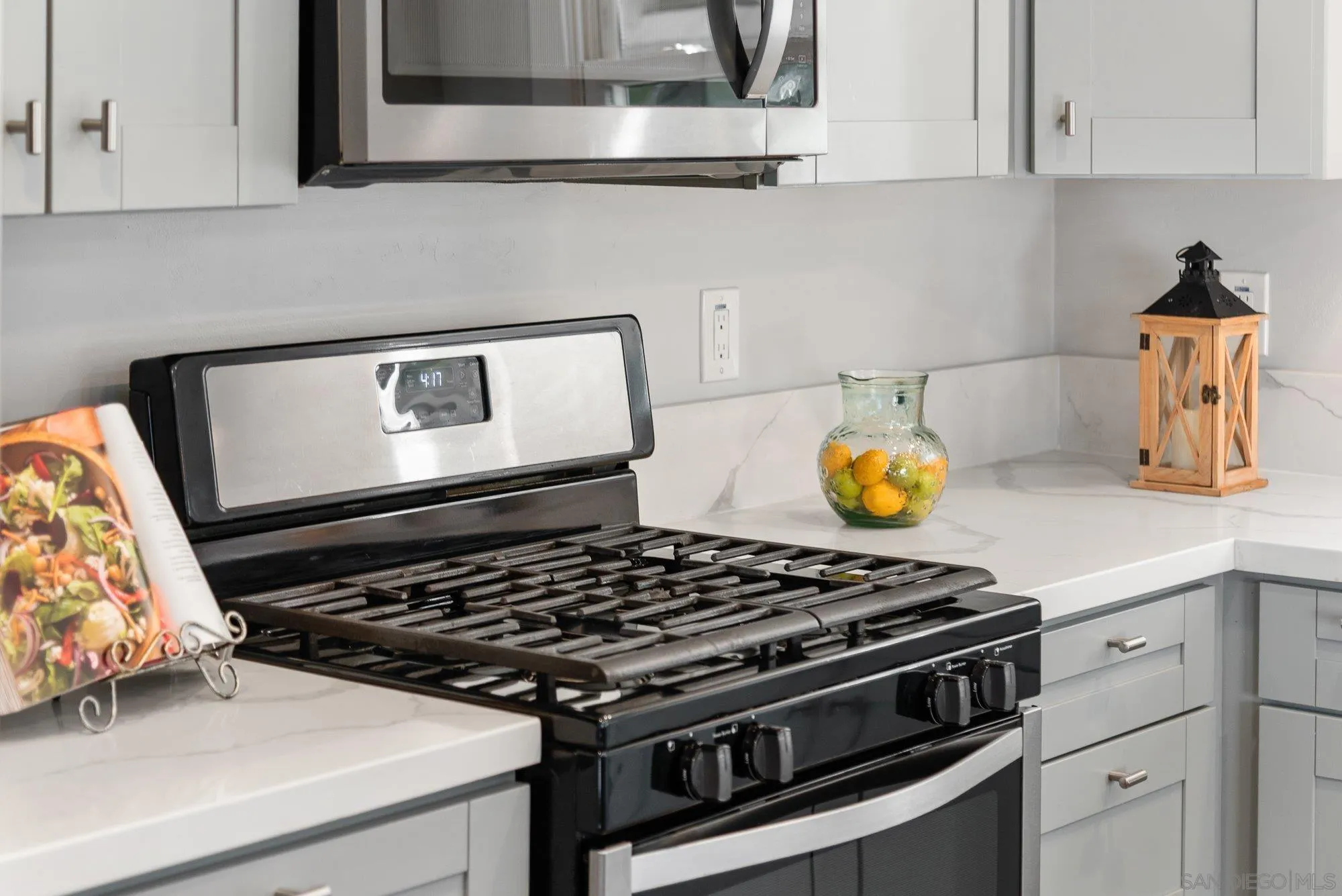 222 Gull Place El Cajon, CA 92019 - Photo 15 of 53 a stove top oven sitting inside of a kitchen