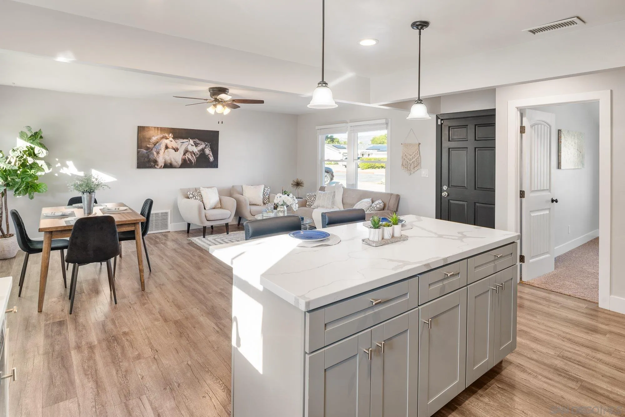 222 Gull Place El Cajon, CA 92019 - Photo 17 of 53 a view of a kitchen counter space dining table and chairs