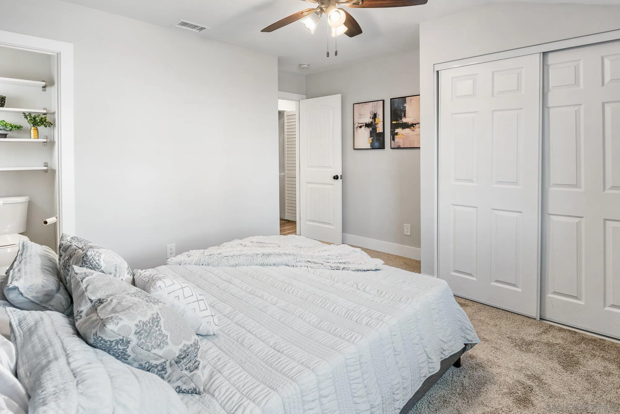 222 Gull Place El Cajon, CA 92019 - Photo 20 of 53 a bedroom with a bed and a chandelier