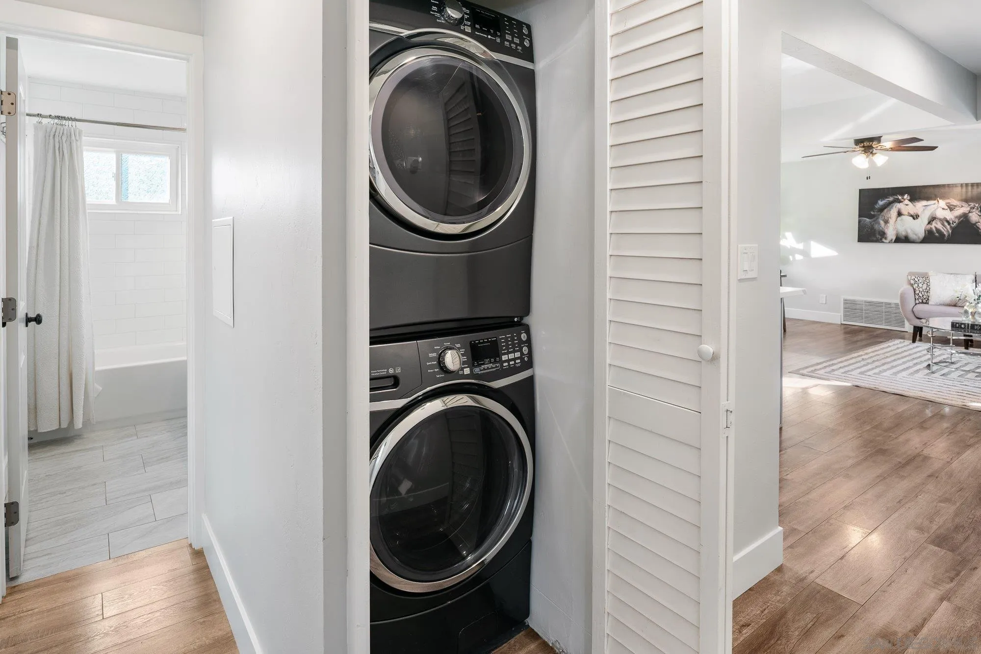 222 Gull Place El Cajon, CA 92019 - Photo 31 of 53 a view of a hallway with washer and dryer