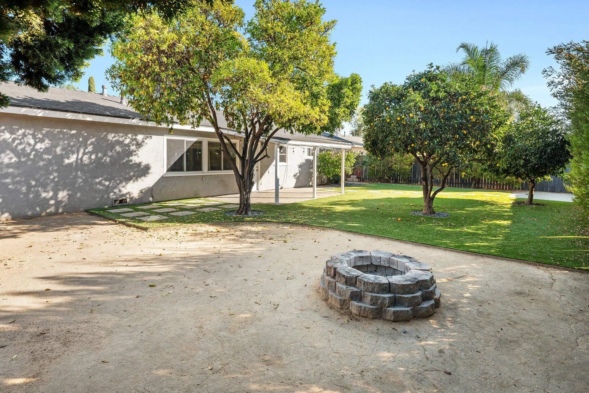 222 Gull Place El Cajon, CA 92019 - Photo 38 of 53 a view of a backyard with a garden and trees