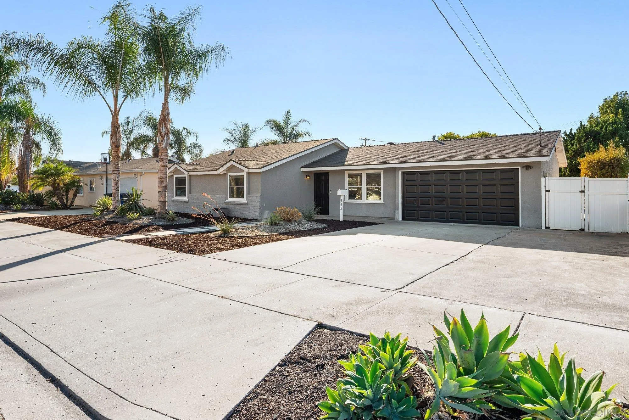 222 Gull Place El Cajon, CA 92019 - Photo 51 of 53 a front view of a house with a yard and garage