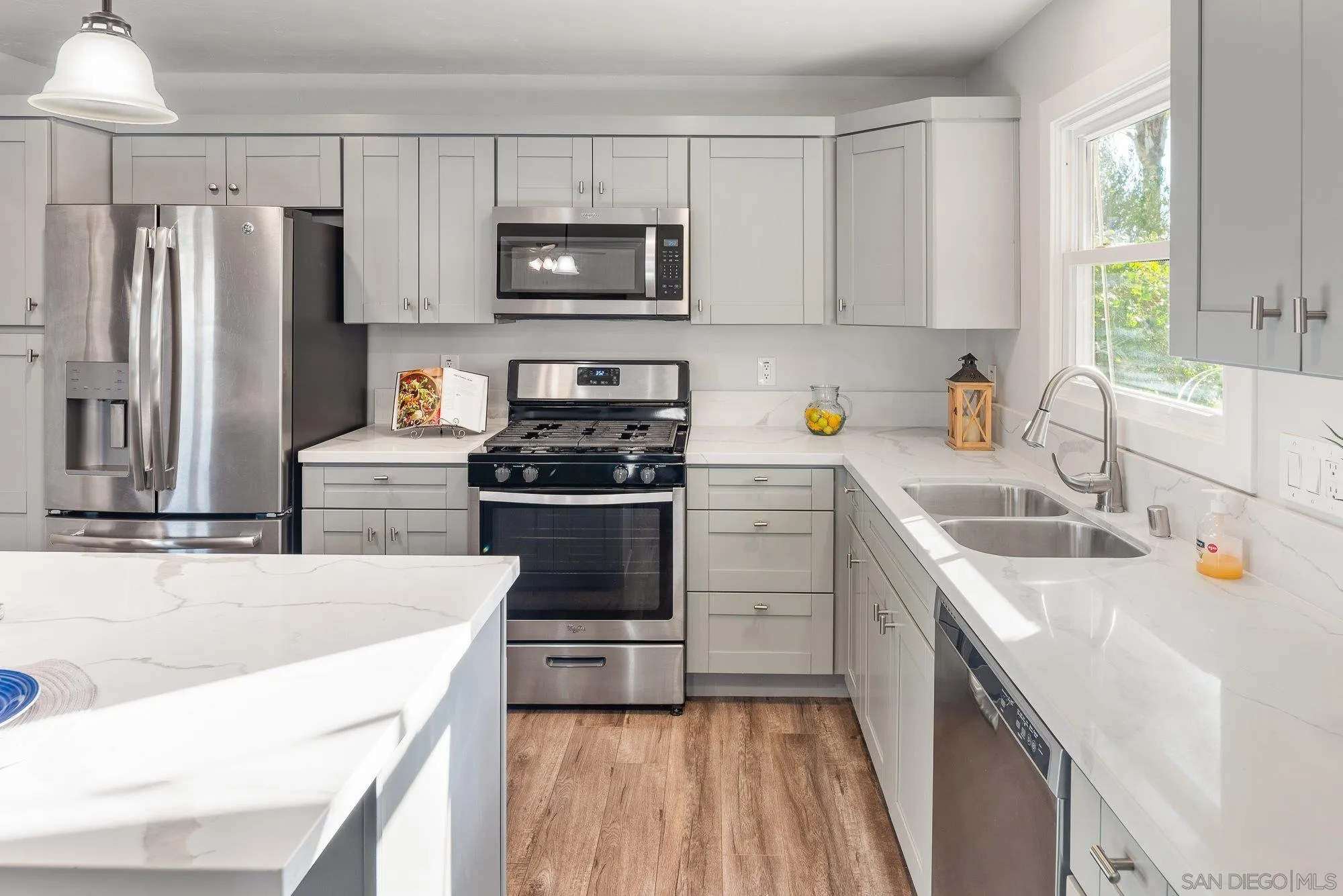 222 Gull Place El Cajon, CA 92019 - Photo 10 of 53 a kitchen with a sink a stove and refrigerator