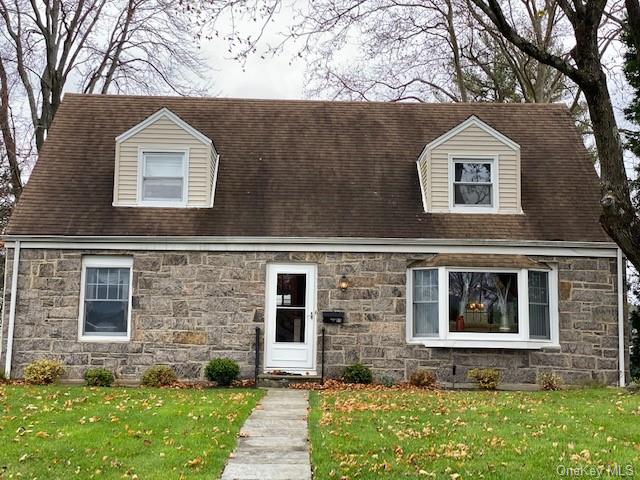 Welcome to 89 Whitman Road. Westchester Hills Neighborhood. Stone front cape cod style immaculate home.