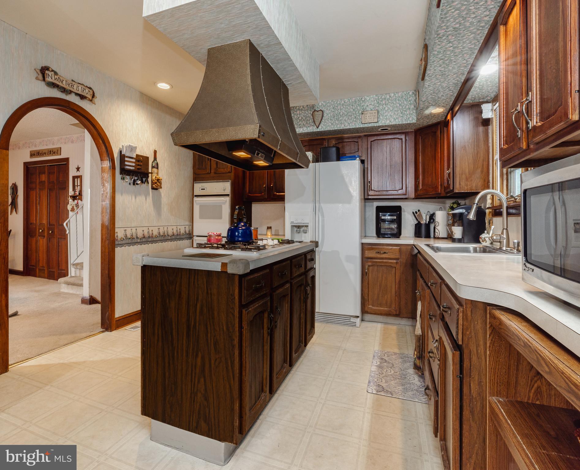 718 Lancing Road West Deptford, NJ 08096 - Photo 19 of 31 Kitchen with island and stovetop with cabinets