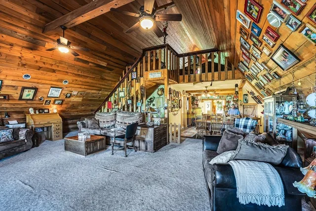 a view of a couch and chairs in the room