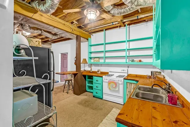 a bed room with a bed and a television