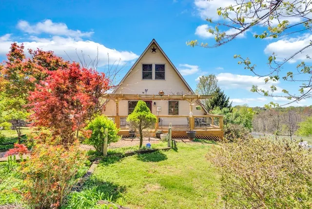 a view of a garden with a building in the background