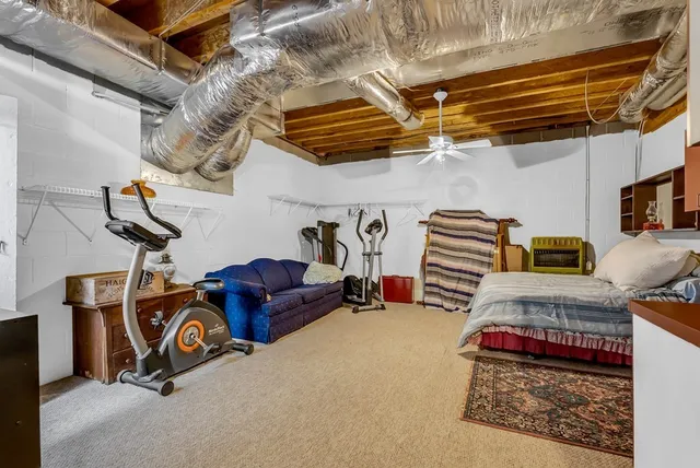 a view of a deck with couches chairs and wooden floor