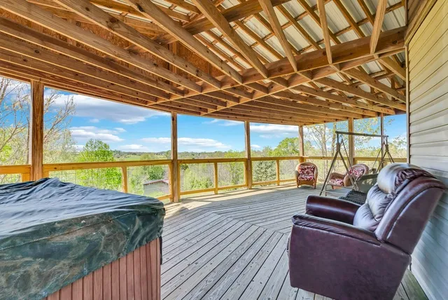 a sitting area with furniture on wooden deck