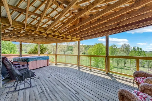 a yellow house with a tree in the background