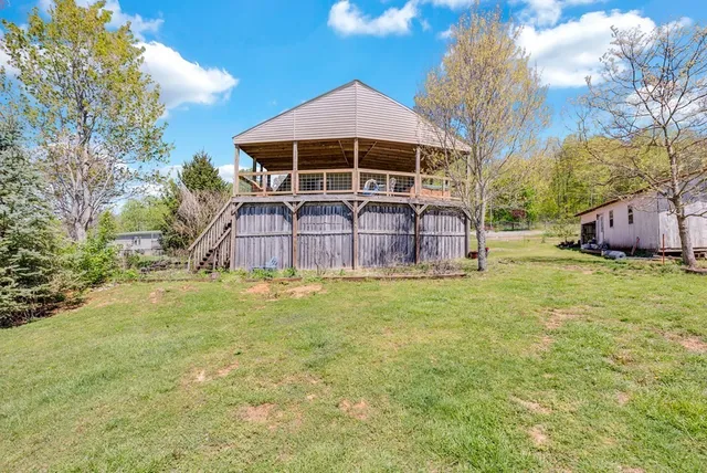 a view of a backyard with plants and a patio