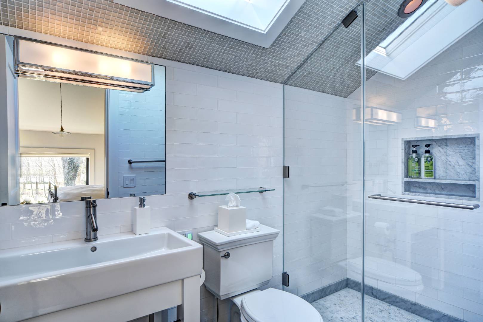 295 Main Street Sag Harbor, NY 11963 - Photo 14 of 21 a bathroom with a sink toilet and shower