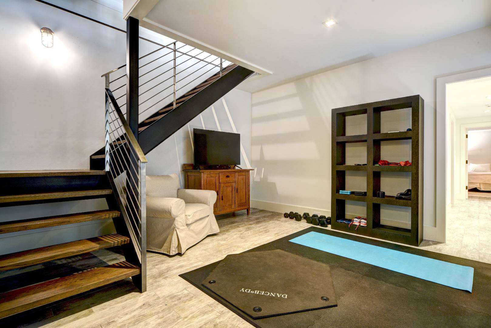 295 Main Street Sag Harbor, NY 11963 - Photo 15 of 21 a living room with furniture and a flat screen tv