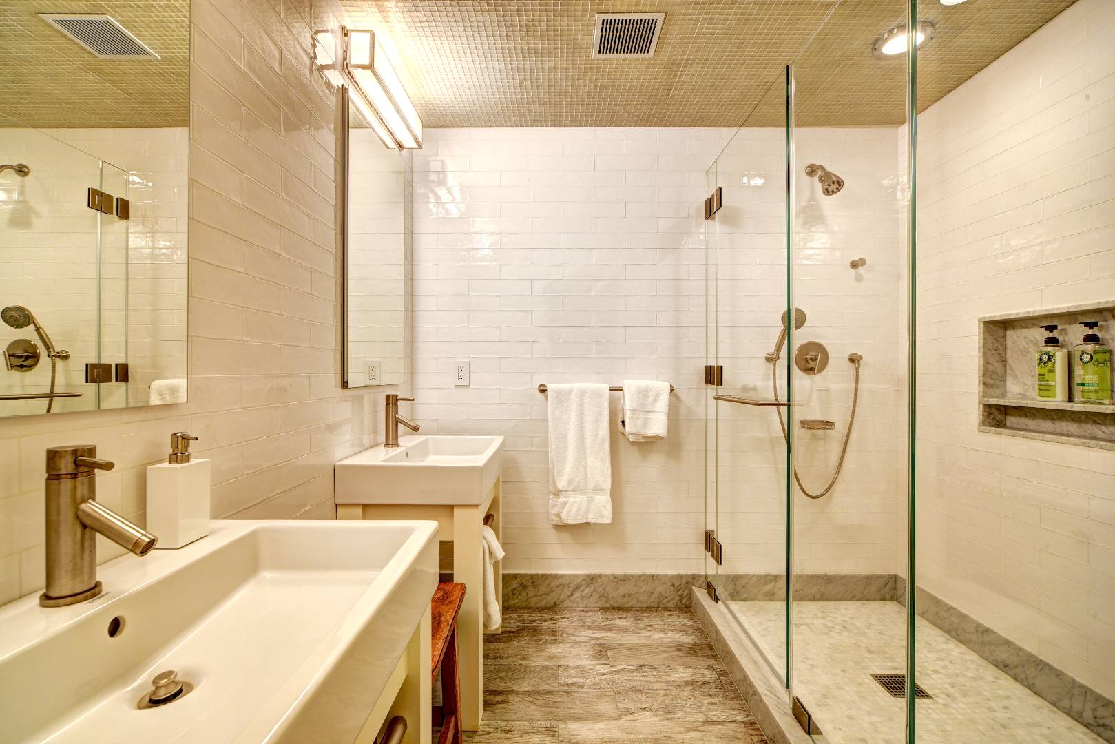 295 Main Street Sag Harbor, NY 11963 - Photo 19 of 21 a bathroom with a tub sink and mirror