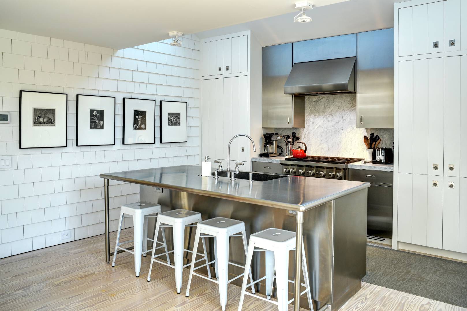 295 Main Street Sag Harbor, NY 11963 - Photo 5 of 21 a kitchen with stainless steel appliances kitchen island granite countertop a sink and cabinets