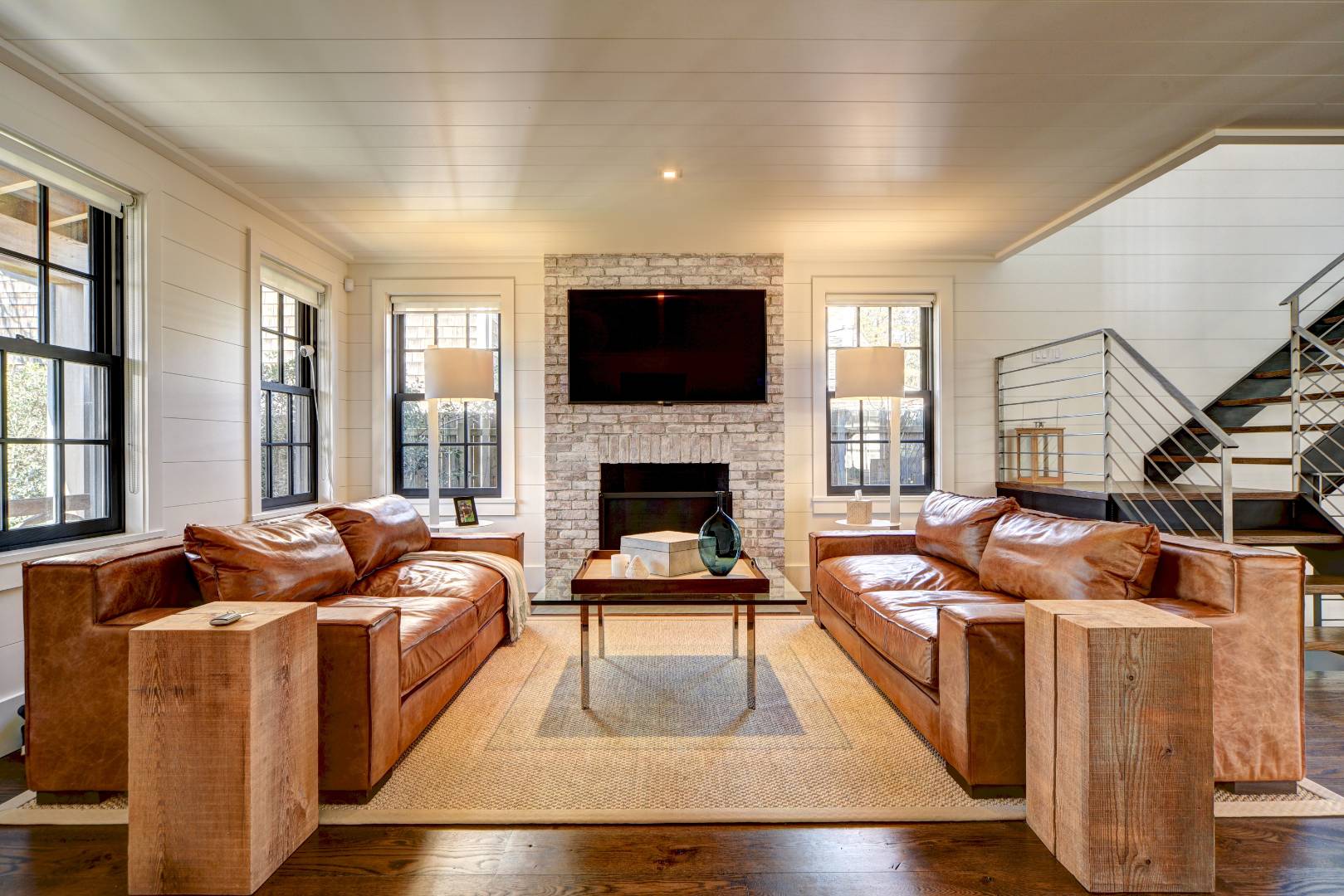295 Main Street Sag Harbor, NY 11963 - Photo 7 of 21 a living room with furniture and a fireplace