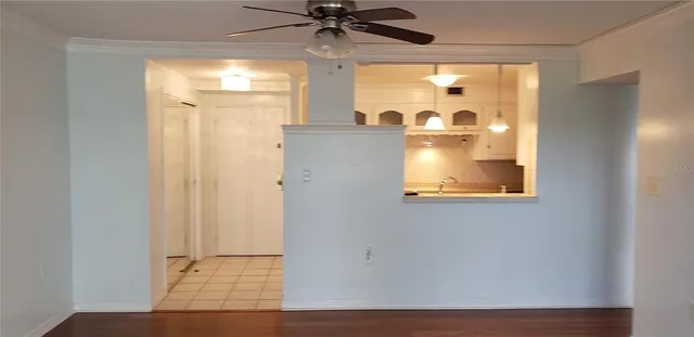 a kitchen with a stove a sink and a microwave