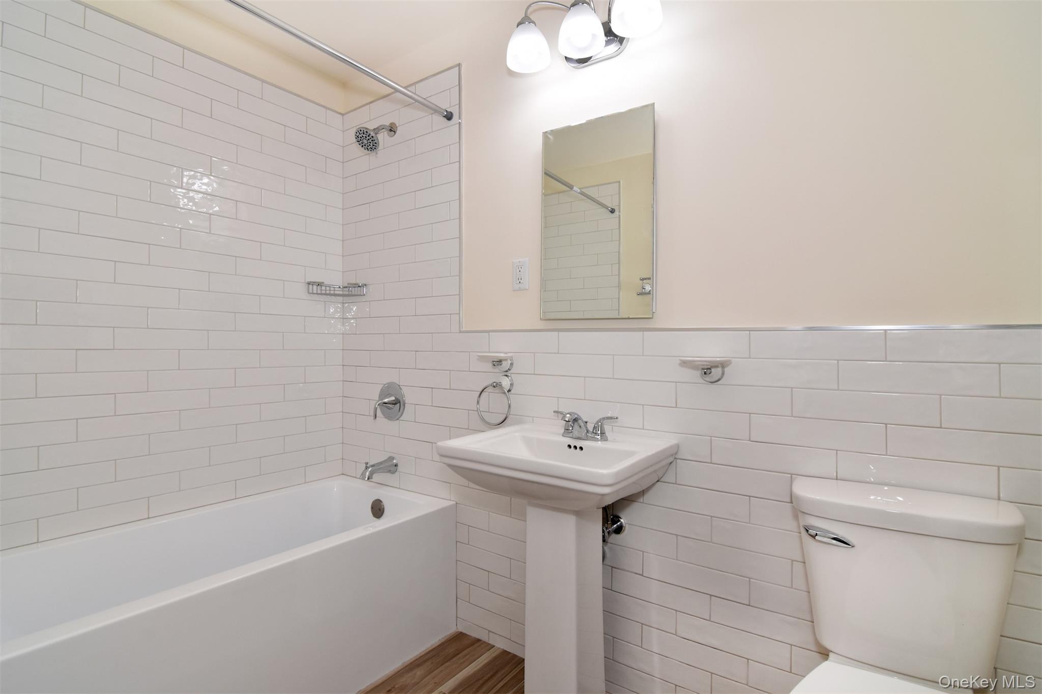 74 Briary Road Dobbs Ferry, NY 10522 - Photo 12 of 19 Brand new primary bath with subway tiles and new fixtures