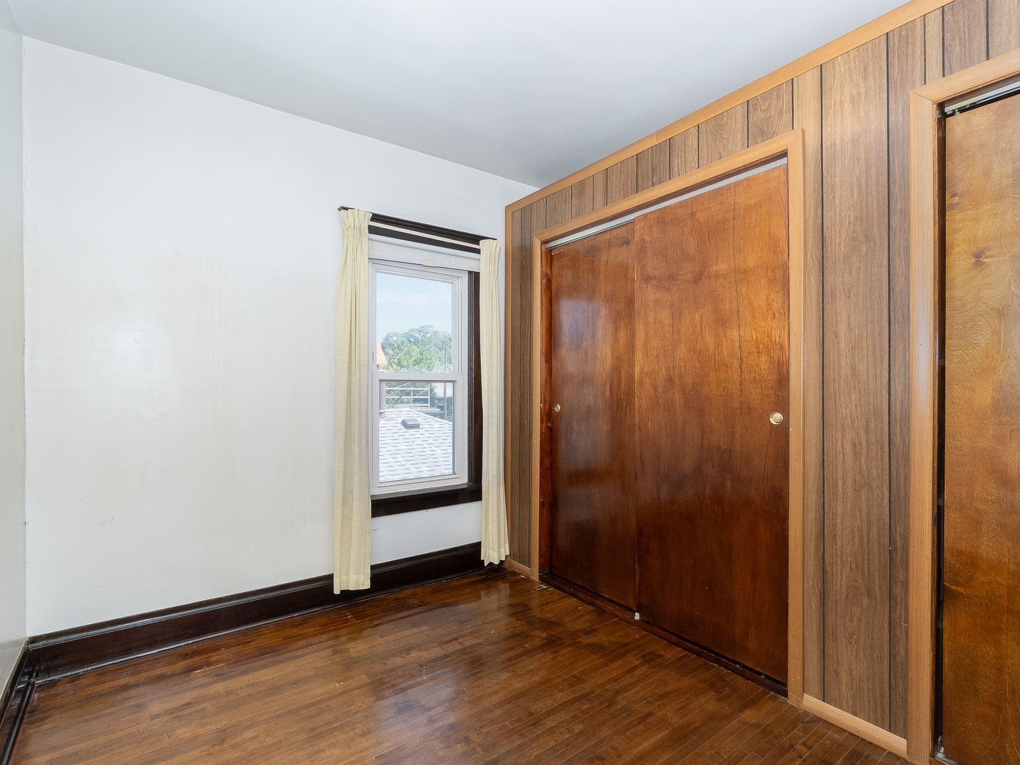 121 Davis Avenue, Unit 2 Rockdale, IL 60436 - Photo 10 of 12 a view of an empty room with closet and wooden floor