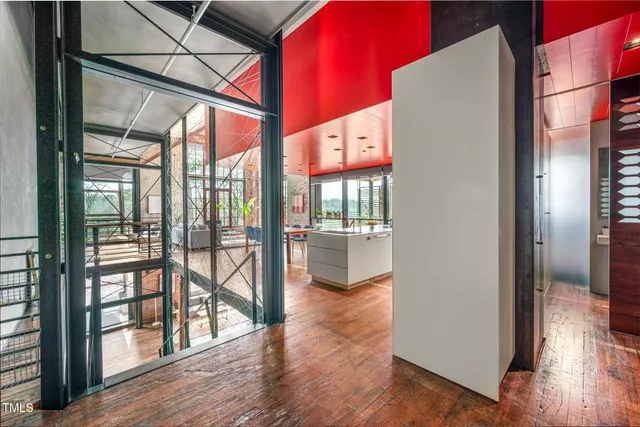 a kitchen with granite countertop a sink a stove and cabinets
